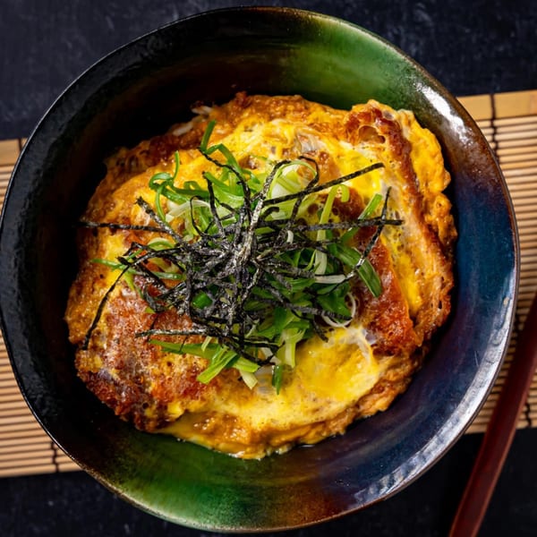 Shinjiru Ramen's Katsudon, a bowl of crispy pork cutlet, egg, green onions, and nori.