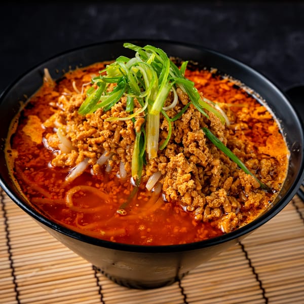 Shinjiru Ramen's spicy ramen bowl with ground meat, bean sprouts, and green onions.