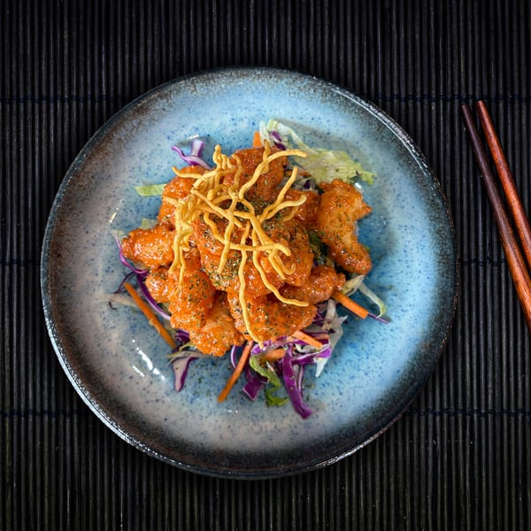 Shinjiru Ramen's Bang Bang Shrimp, crispy shrimp in spicy sauce, with shredded cabbage and carrots.