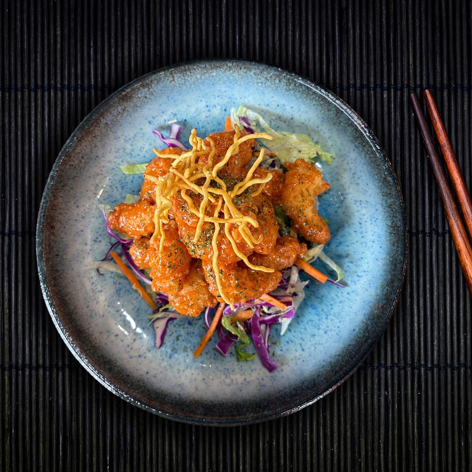Shinjiru Ramen's Bang Bang Shrimp, crispy shrimp in spicy sauce, with shredded cabbage and carrots.